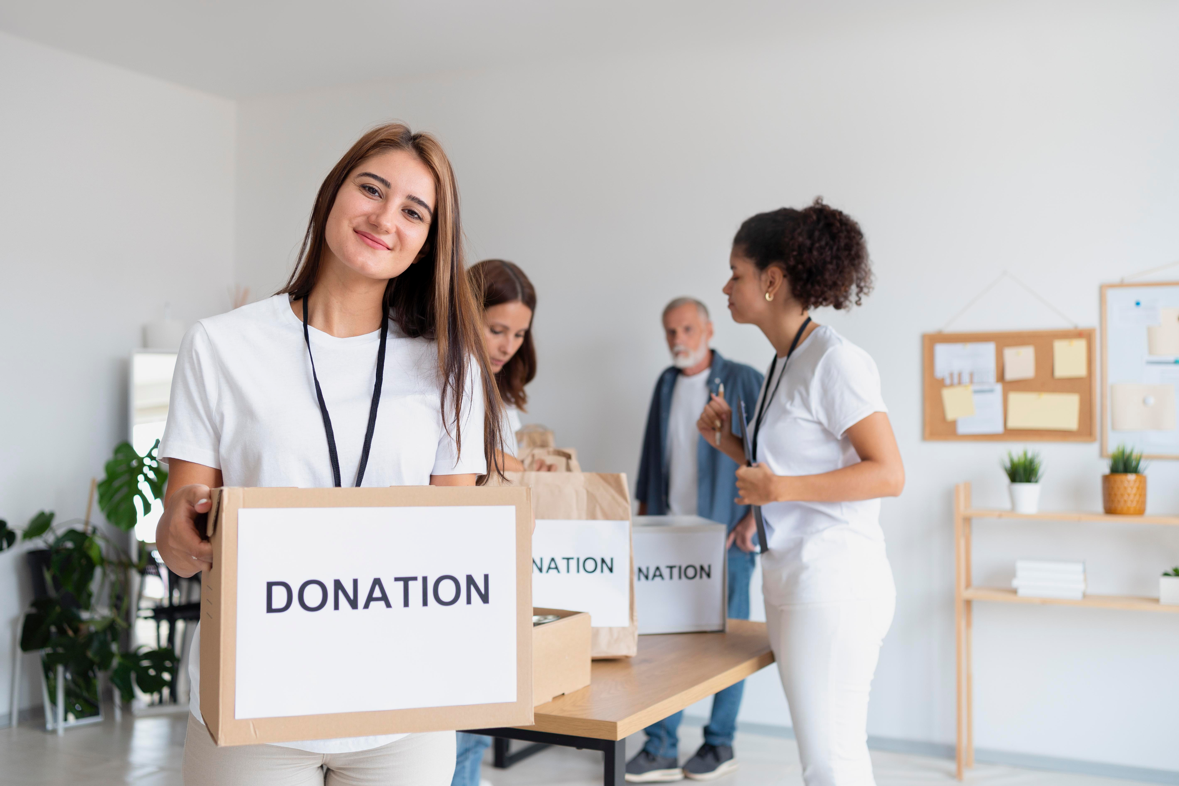 Volunteers with donation boxes — Be the Answer