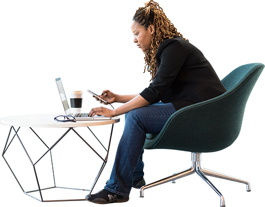 woman sitting on chair with laptop